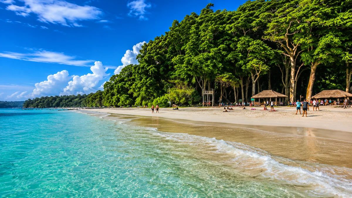 Crystal-clear turquoise water and white sandy shoreline at Radhanagar Beach on Swaraj Dweep (Havelock Island), Andaman Islands.