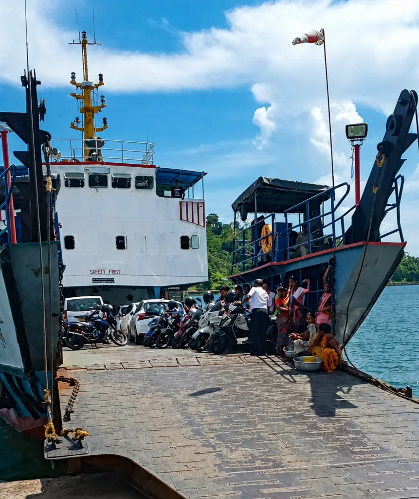 Government vehicle ferry departing from Chatham Jetty to Bambooflat carrying passengers, scooters, and cars bound for North Bay Island Andaman route.