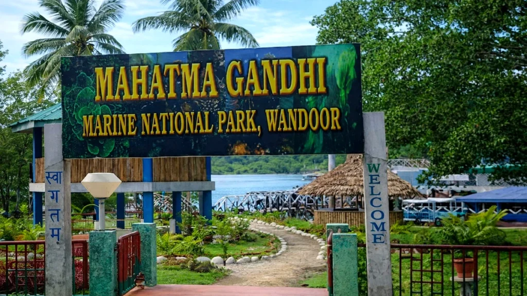 Mahatma Gandhi Marine National Park entrance gate at Wandoor Beach, Port Blair, Andaman Islands with clear view of pathway leading to the jetty and sea.