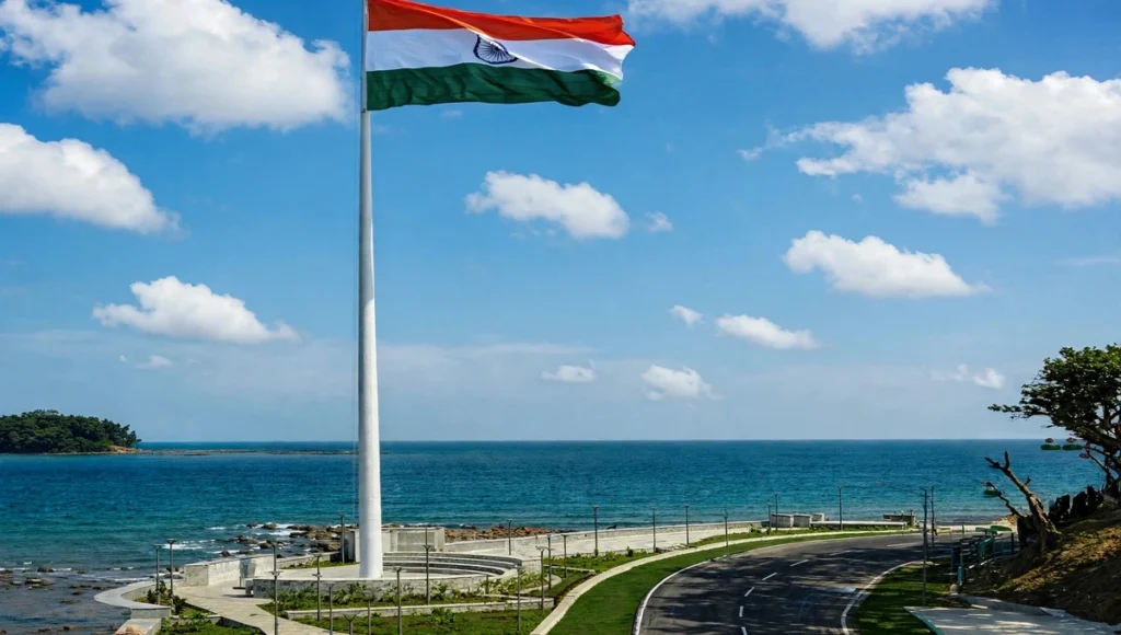 Flag Point Port Blair with towering Indian national flag at Tiranga Park overlooking turquoise sea and coastal road in Andaman Islands.